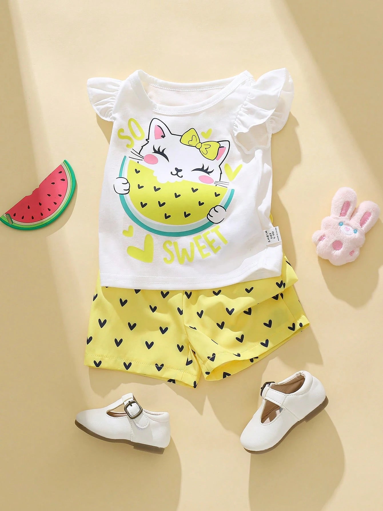 Conjunto amarillo dulce con estampado de gato