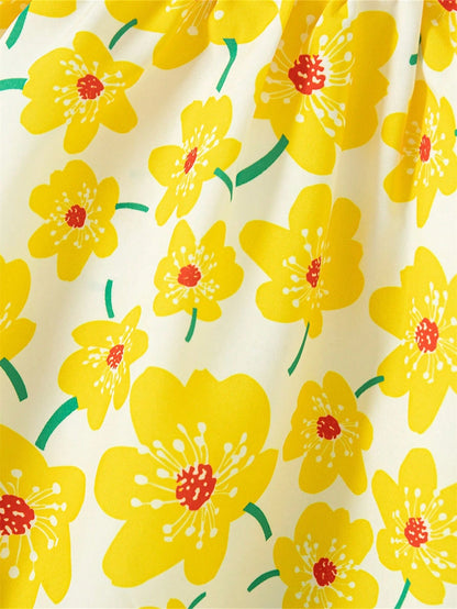 Prenda amarilla vestido para bebe detalle de tela y flores