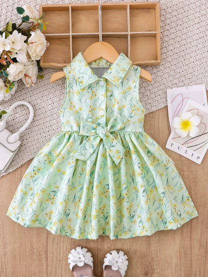 Prenda verde vestido floral para bebe con lazo vista frontal
