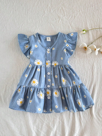 Prenda azul vestido floral para bebe con margaritas y volantes vista frontal