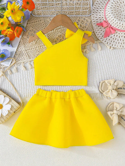 Set amarillo bebé niña con top de tirantes y falda con moño