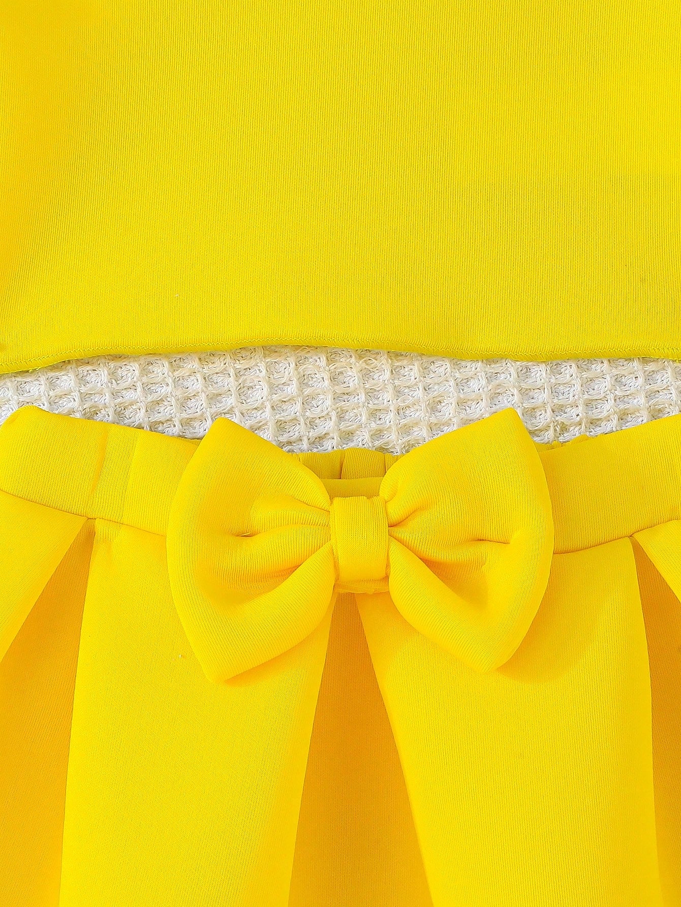 Set amarillo bebé niña con top de tirantes y falda con moño