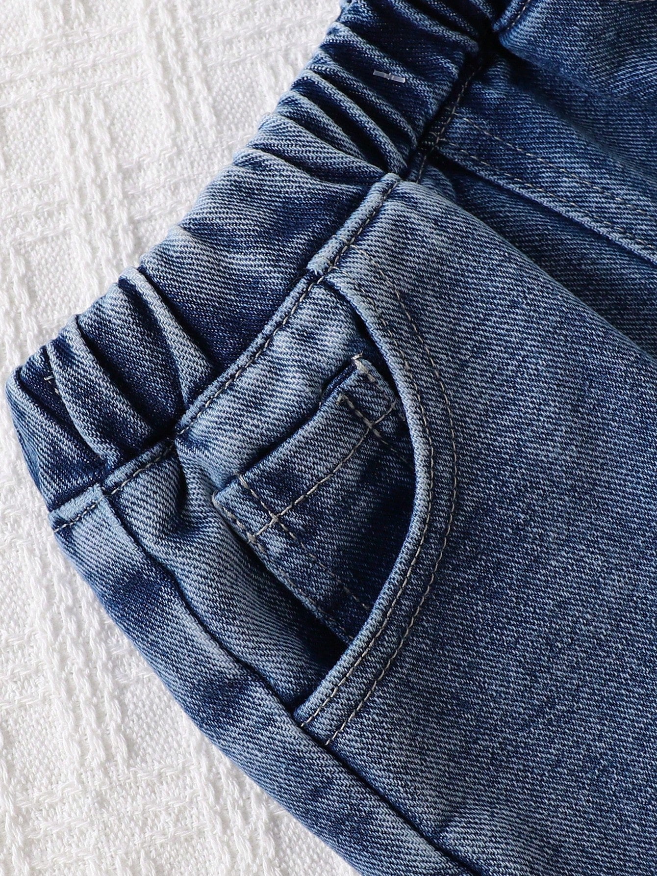 Prenda azul conjunto para bebe con detalle de short denim con bolsillos