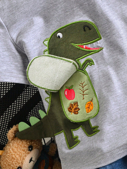 Prenda gris camiseta para bebe con dinosaurio bordado detalle