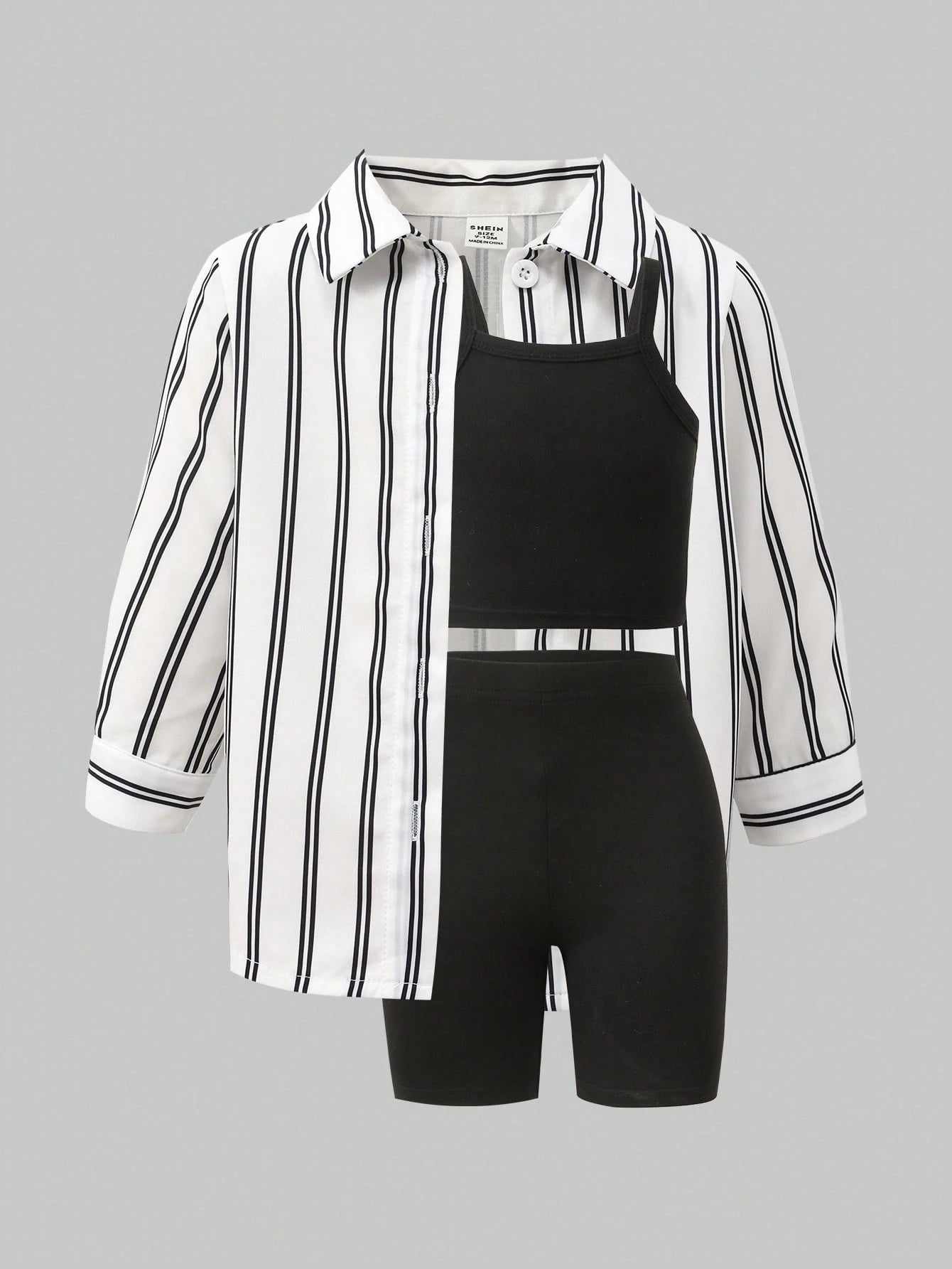Prenda blanca y negra conjunto para bebe de tres piezas a rayas vista frontal