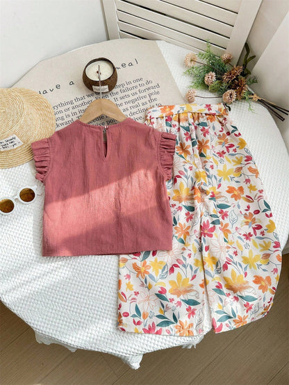 Prenda rosa conjunto para bebe con pantalón floral vista trasera
