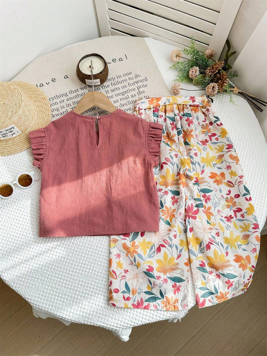 Prenda rosa conjunto para bebe con pantalón floral vista trasera
