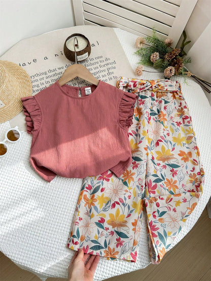 Prenda rosa conjunto para bebe con pantalón floral vista frontal
