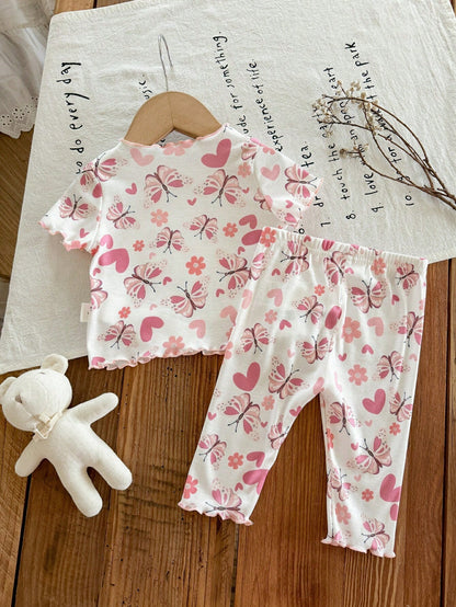 Prenda blanca conjunto para bebe con mariposas rosadas vista trasera