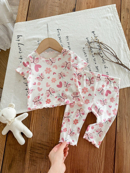 Prenda blanca conjunto para bebe con mariposas rosadas vista frontal
