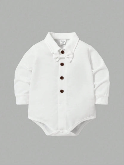 Prenda blanca body para bebe con botones frontales y corbatín

