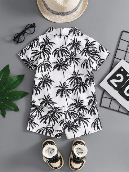 Prenda blanco negro conjunto tropical para bebe con estampado de palmeras vista trasera