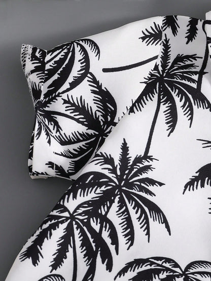 Prenda blanco negro conjunto tropical para bebe detalle de tela con palmeras