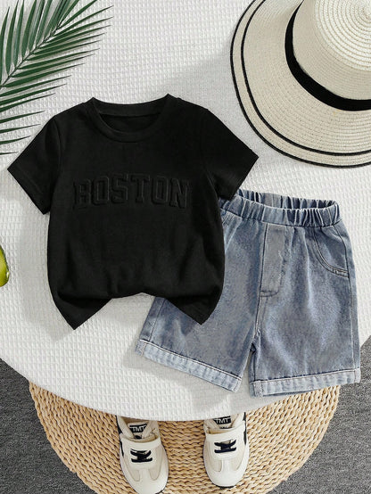 Prenda negra conjunto para bebe con short de mezclilla azul vista frontal