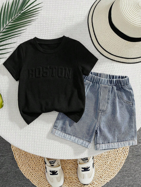 Prenda negra conjunto para bebe con short de mezclilla azul vista frontal