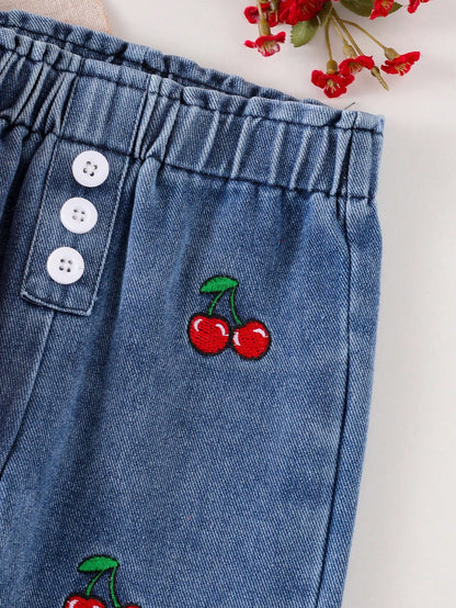 Pantalón de mezclilla azul para bebe con cintura elástica y botones decorativos