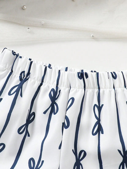 Prenda blanco pantalón para bebe con estampado de lazos detalle de la tela