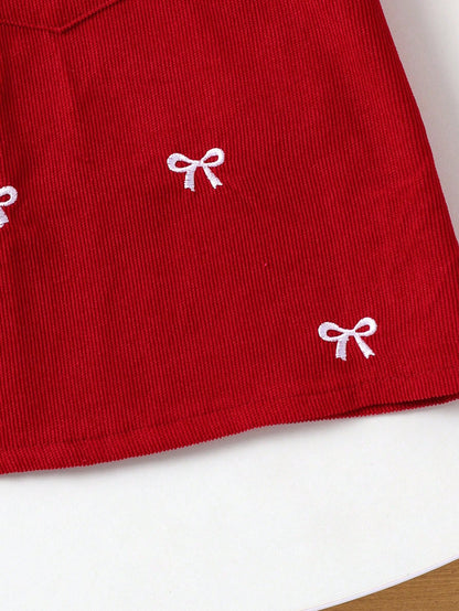 Prenda burdeos vestido para bebe detalle de lazos bordados