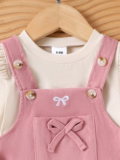 Prenda rosa vestido para bebe detalle de botones y lazo frontal