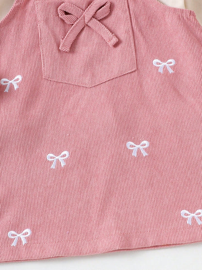 Prenda rosa vestido para bebe detalle de lazos bordados y bolsillo