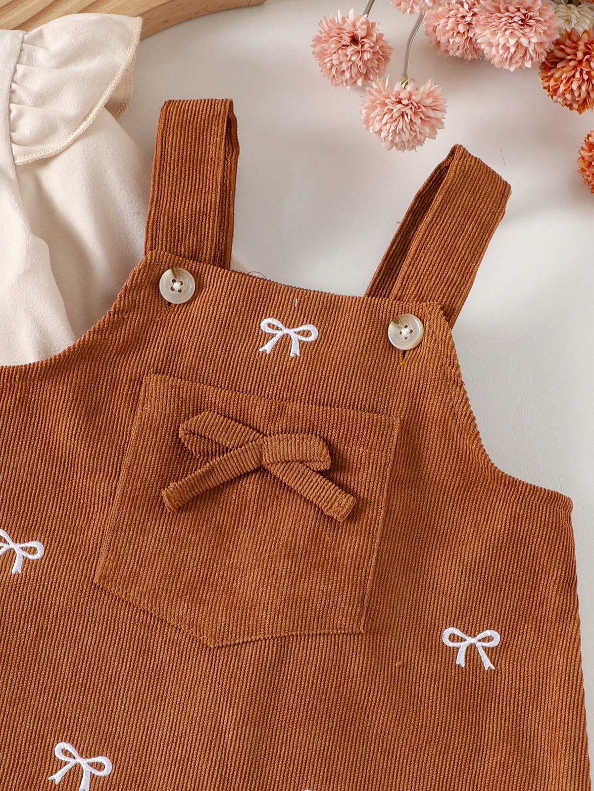 Prenda albaricoque vestido para bebe detalle de bolsillo y lazo decorativo