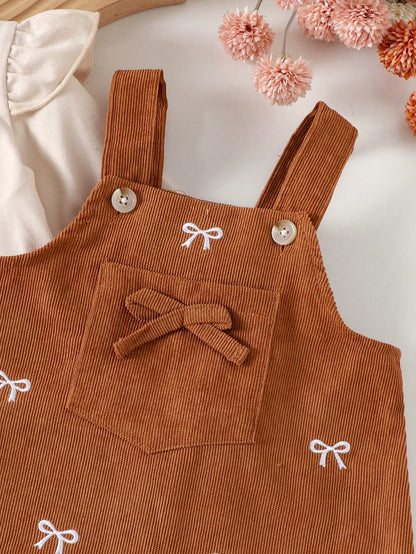 Prenda albaricoque vestido para bebe detalle de bolsillo y lazo decorativo