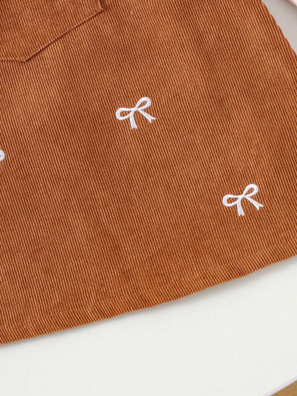 Prenda albaricoque vestido para bebe detalle de lazos bordados