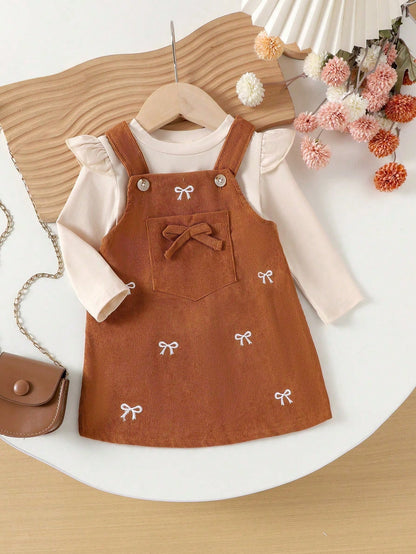Prenda albaricoque conjunto para bebe con vestido de tirantes y lazos bordados vista frontal