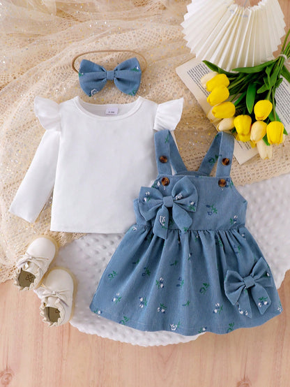 Prenda azul conjunto para bebe con vestido floral y moño vista frontal
