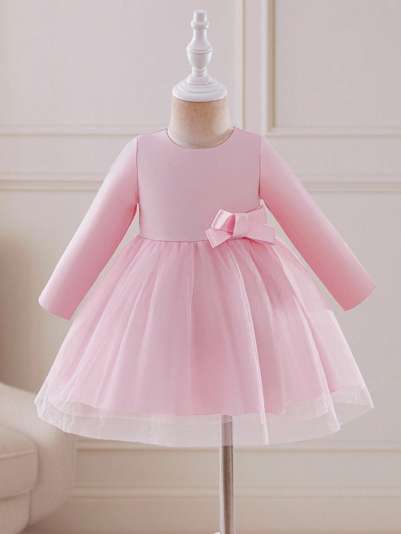 Prenda rosa vestido para bebe con moño y falda de tul vista frontal