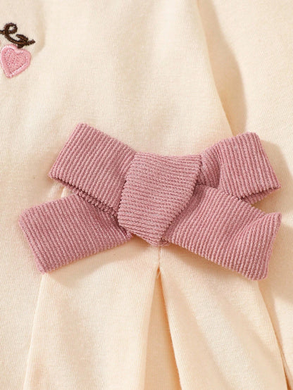 Prenda albaricoque vestido para bebe detalle de lazo rosado lateral