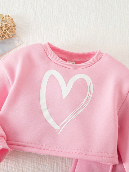 Conjunto rosa con sudadera corta y pantalón