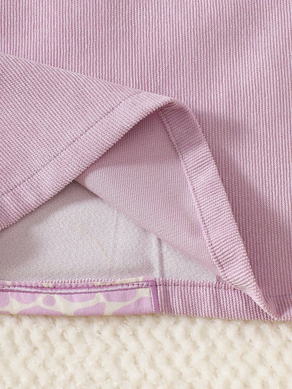 Prenda lila vestido para bebe con detalle de textura acanalada