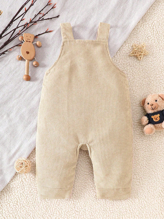 Prenda beige peto para bebe con oso bordado texturizado vista trasera