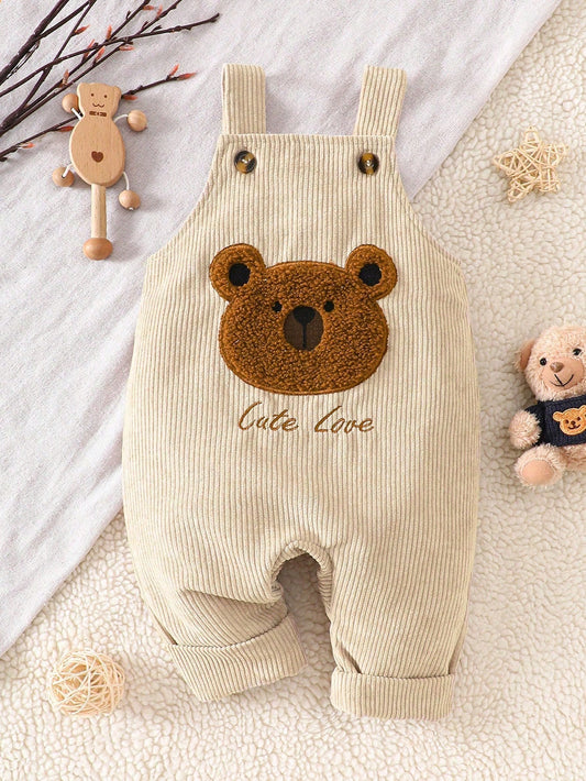 Prenda beige peto para bebe con oso bordado texturizado vista frontal