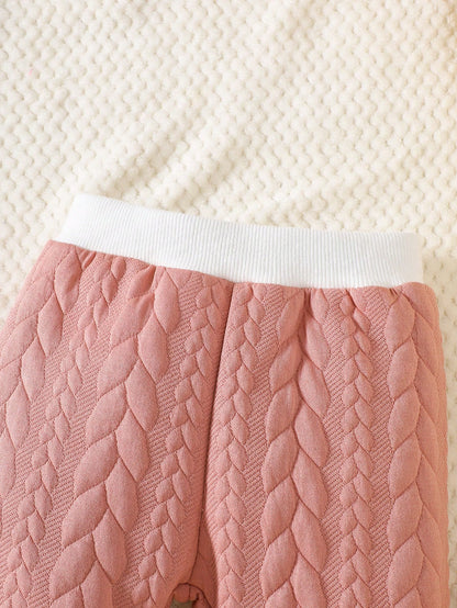Conjunto acolchado rosa tejido botones delantero suave