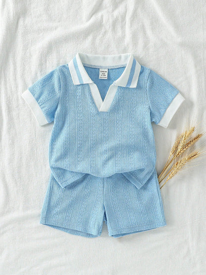 Prenda azul conjunto para bebe con cuello en contraste vista frontal
