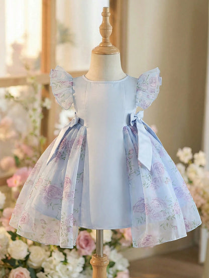 Prenda azul vestido para bebe con flores rosas vista frontal