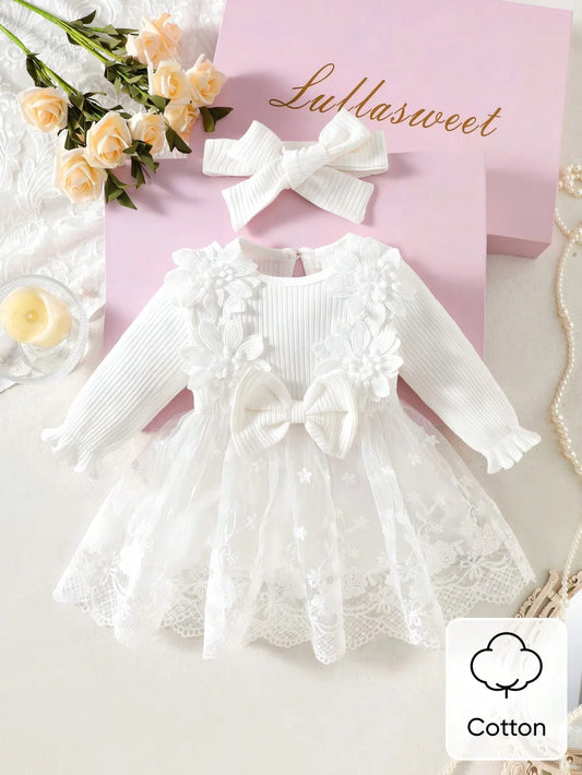 Prenda blanca vestido para bebe con flores bordadas y diadema vista frontal