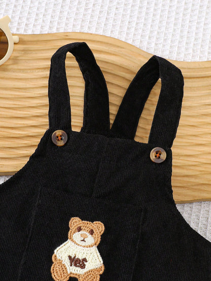 Prenda negro overol de pana para bebe detalle de tirantes con botones
