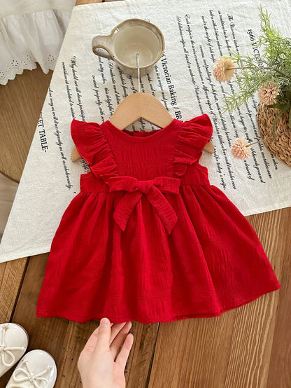 Prenda rojo vestido para bebe con volantes y lazo vista frontal
