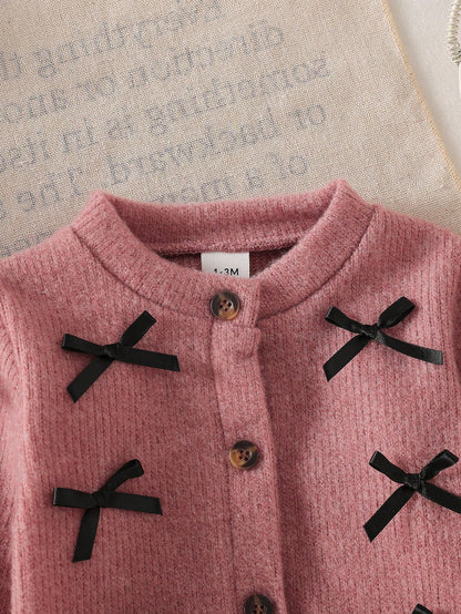 Conjunto de Suéter Tejido Con Lazos Rosa Y Pantalón Negro