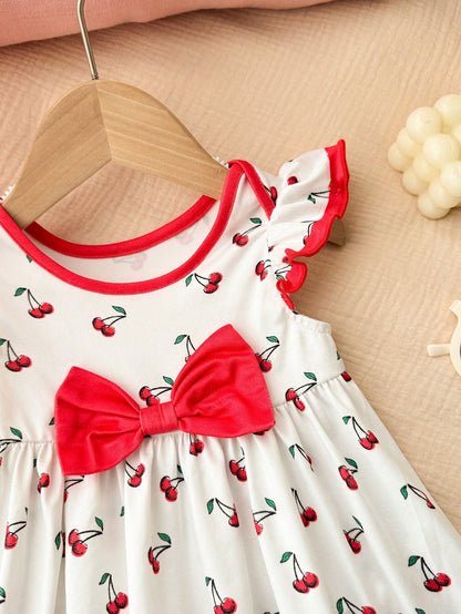 Prenda blanco vestido para bebe con detalle de lazo rojo frontal
