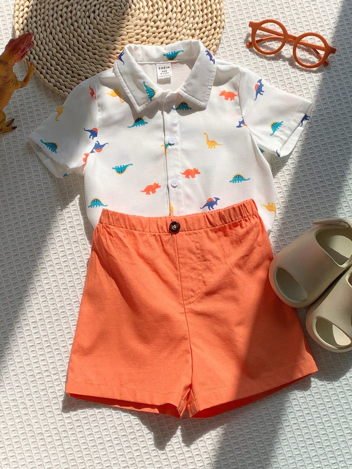 Prenda blanca conjunto para bebe con short naranja detalle