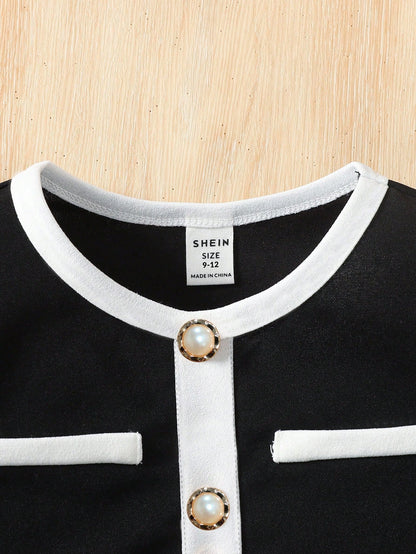 Prenda negro conjunto elegante para bebe detalle de cuello redondo y botones de perla
