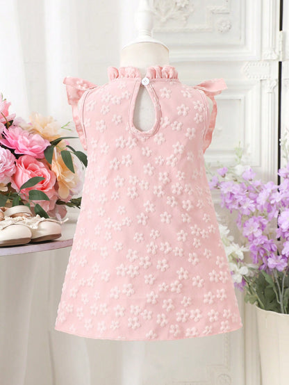 Prenda rosa vestido para bebe con lazo y flores texturizadas vista trasera

