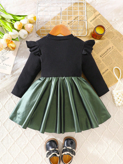 Prenda negro y verde vestido para bebe vista trasera con falda amplia