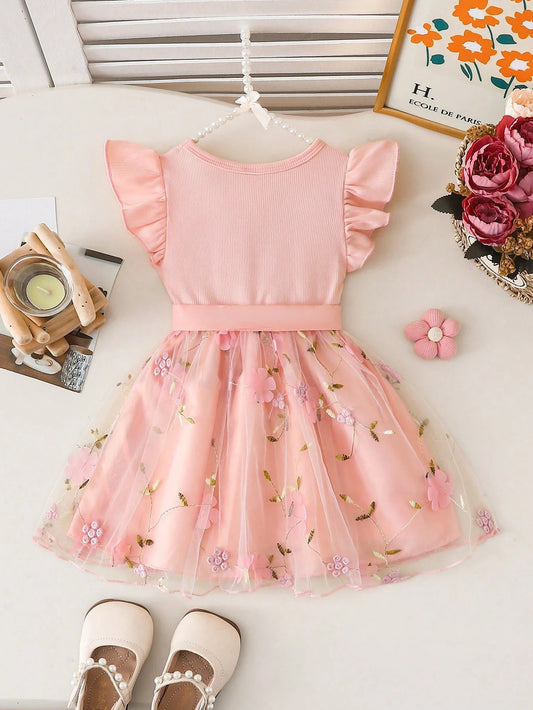Prenda rosa vestido para bebe con tul bordado y lazo vista trasera
