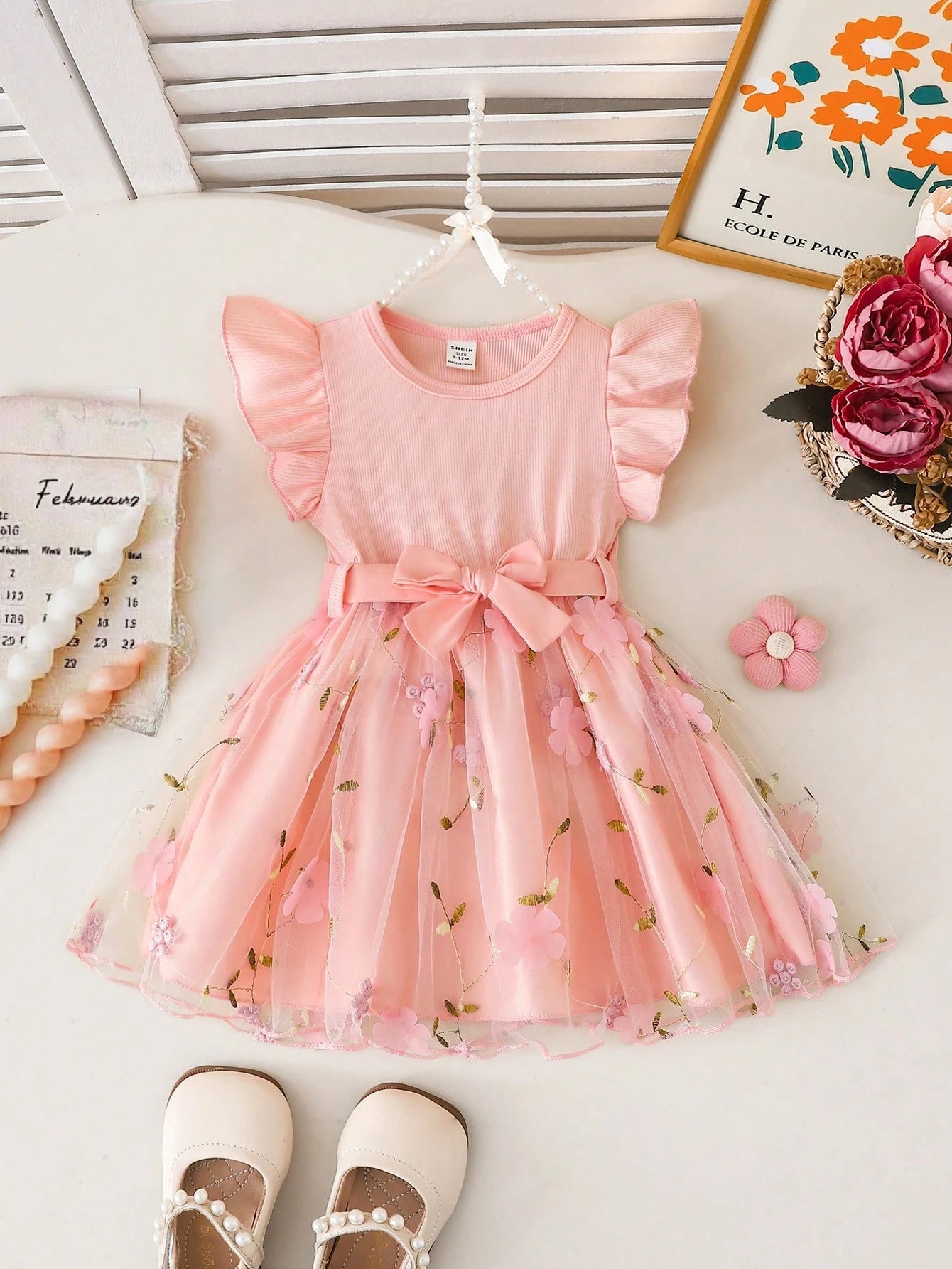 Prenda rosa vestido para bebe con tul bordado y lazo vista frontal
