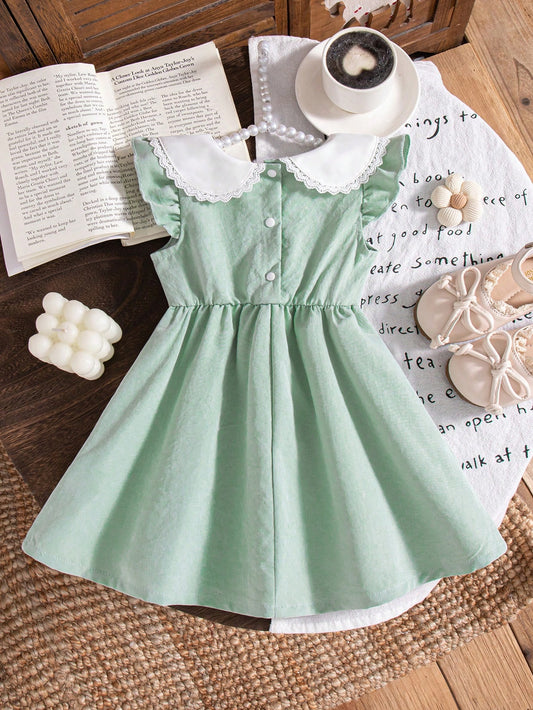 Prenda verde vestido para bebe con cuello Peter Pan bordado vista trasera
